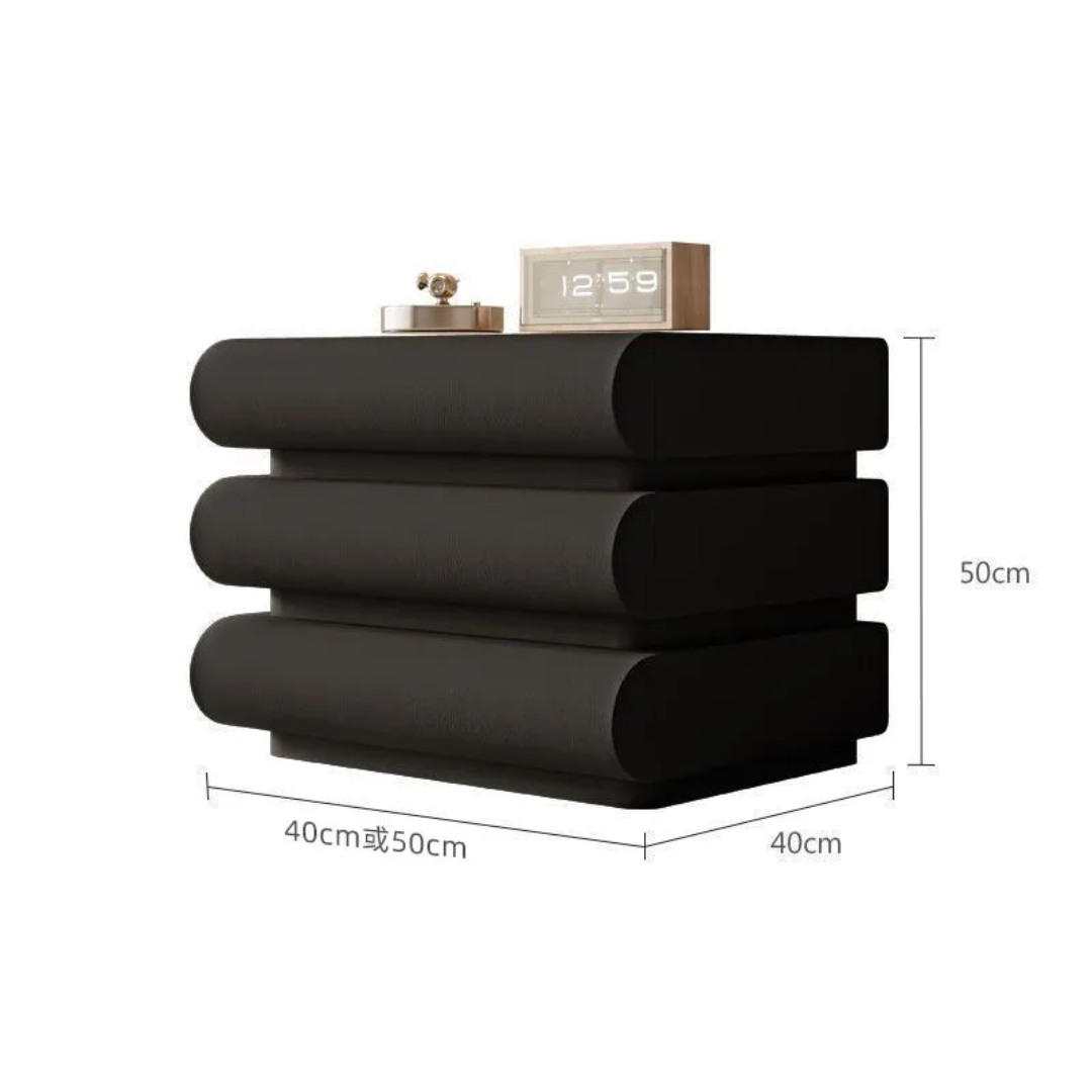 Black folded towels with measurements on a white background