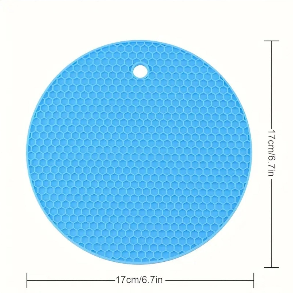Blue round silicone mat with honeycomb pattern and measurements on a white background