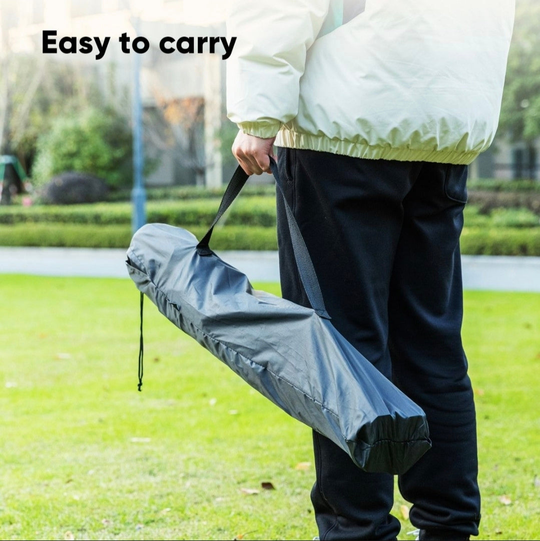 Person holding a folded umbrella with text 'Easy to carry' in an outdoor setting.