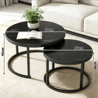 Two nested round nesting coffee tables in a modern living room setting, with dimension lines and text overlays showing measurements of 70cm, 50cm, 45cm, and 38cm. The tables have a black marble-patterned top and a black metal frame base.