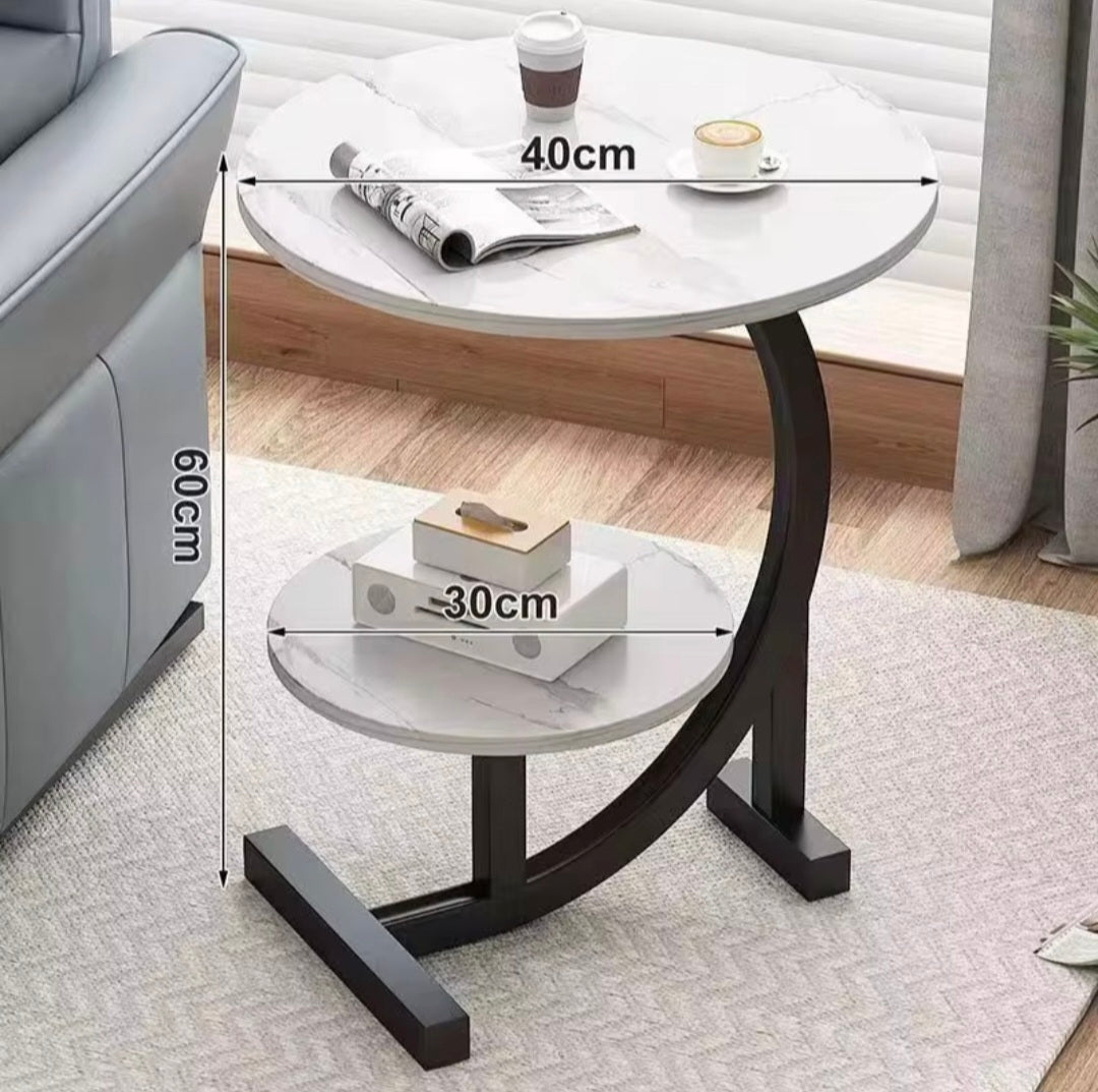 Small round table with dimensions labeled in a home setting