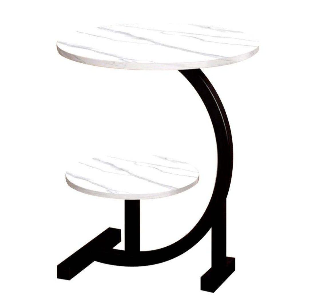 Modern side table with white glass top and black curved base on a white background