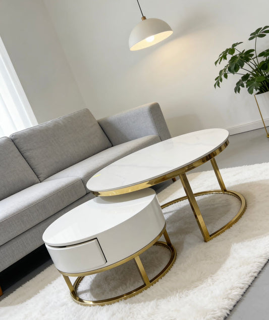 Modern living room with gray sofa and white coffee tables with gold legs.