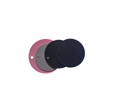 Three circular pads in pink, gray, and black on a white background