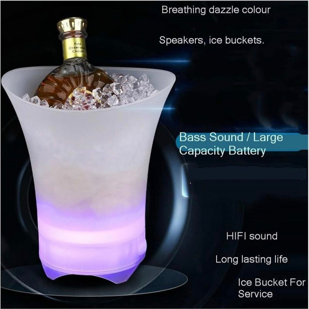 LED ice bucket with bottle of whiskey on a dark background