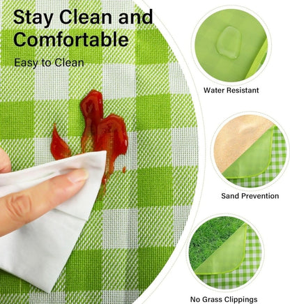 Green checkered mat with a hand wiping it, showing its ease of cleaning and features like water resistance and sand prevention.