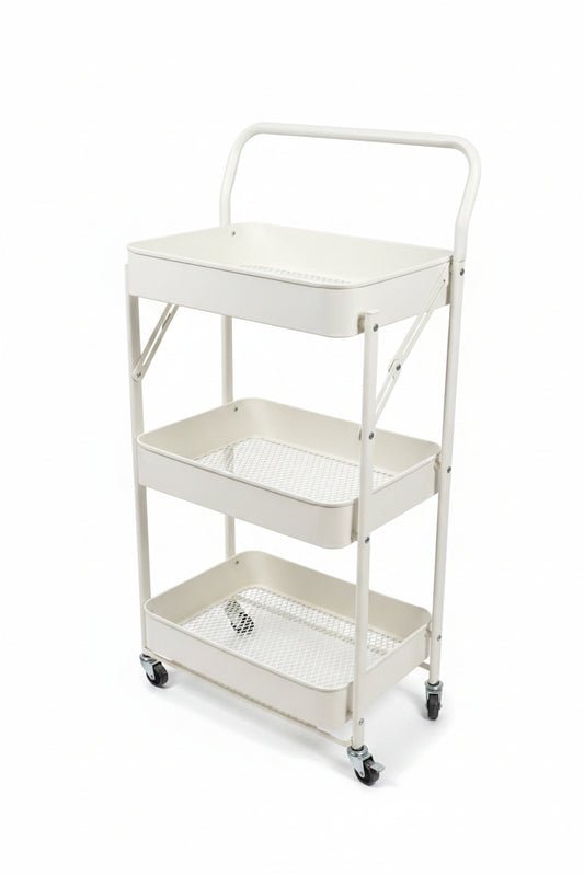 A three-tier white metal rolling cart with mesh shelves and a top handle, shown in an indoor showroom setting with gray tiled floors and storage cabinets in the background.