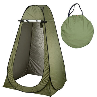 Green pop-up tent with carrying bag on a white background