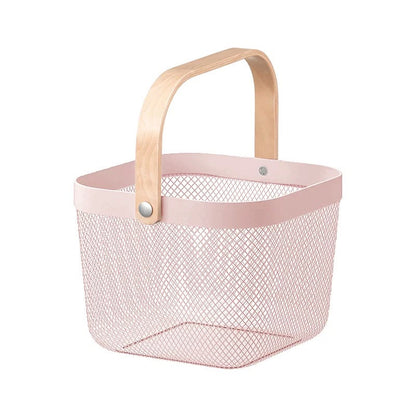 A light pink wire mesh basket with a natural wood handle and a matching pink top rim, shown on a plain white background.