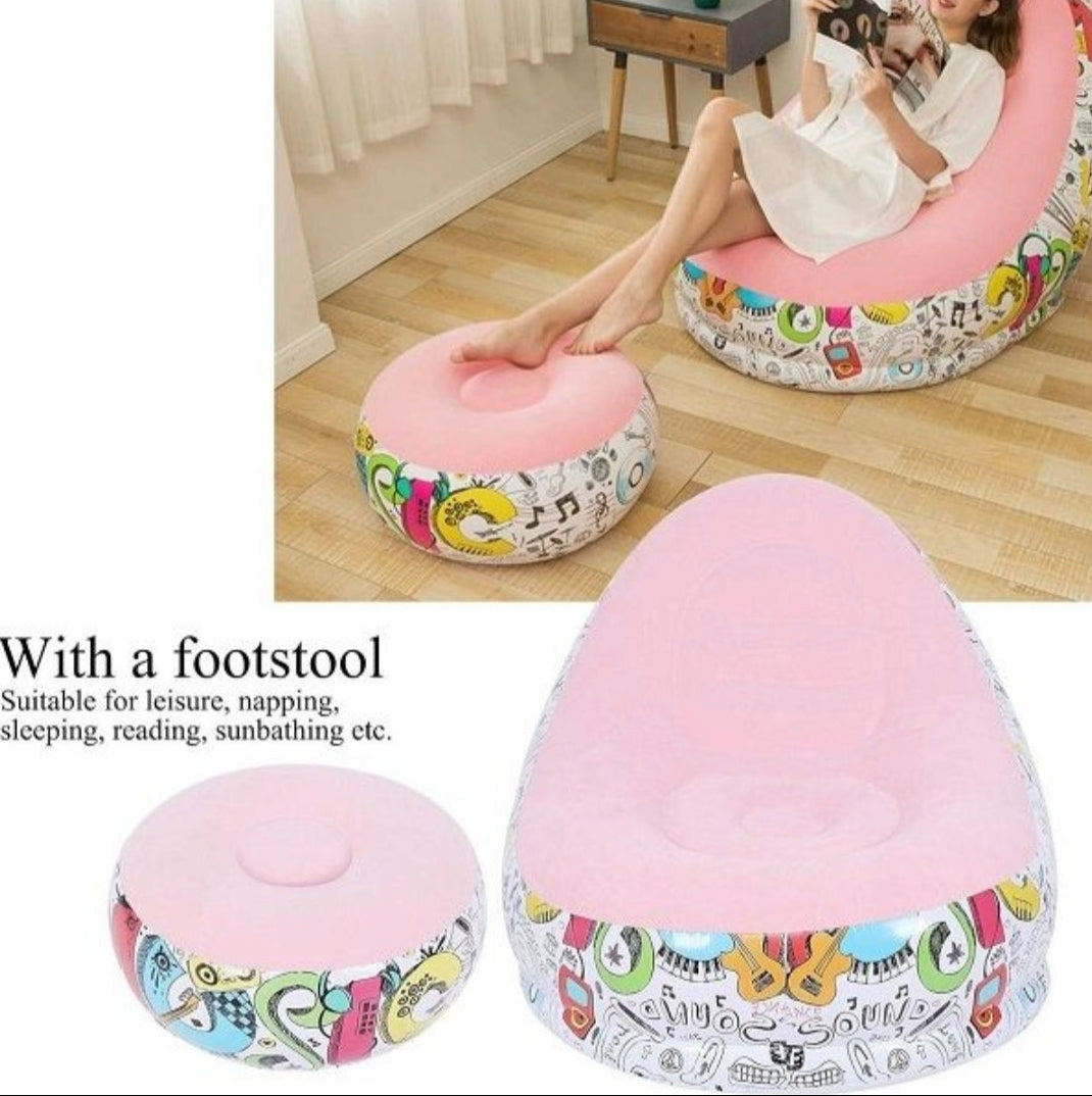 Pink bean bag chair with colorful patterns on a wooden floor.