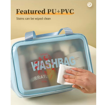Light blue wash bag with transparent window, hand wiping it with a cloth, text 'Featured PU+PVC' and 'Stains can be wiped clean'.