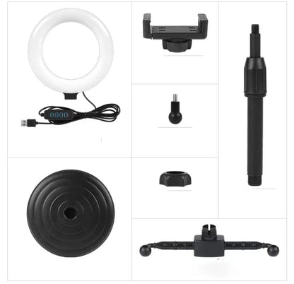 Collection of photography accessories including a ring light, phone holder, and various attachments on a white background.