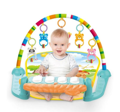 Baby playing with a colorful baby gym on a white background