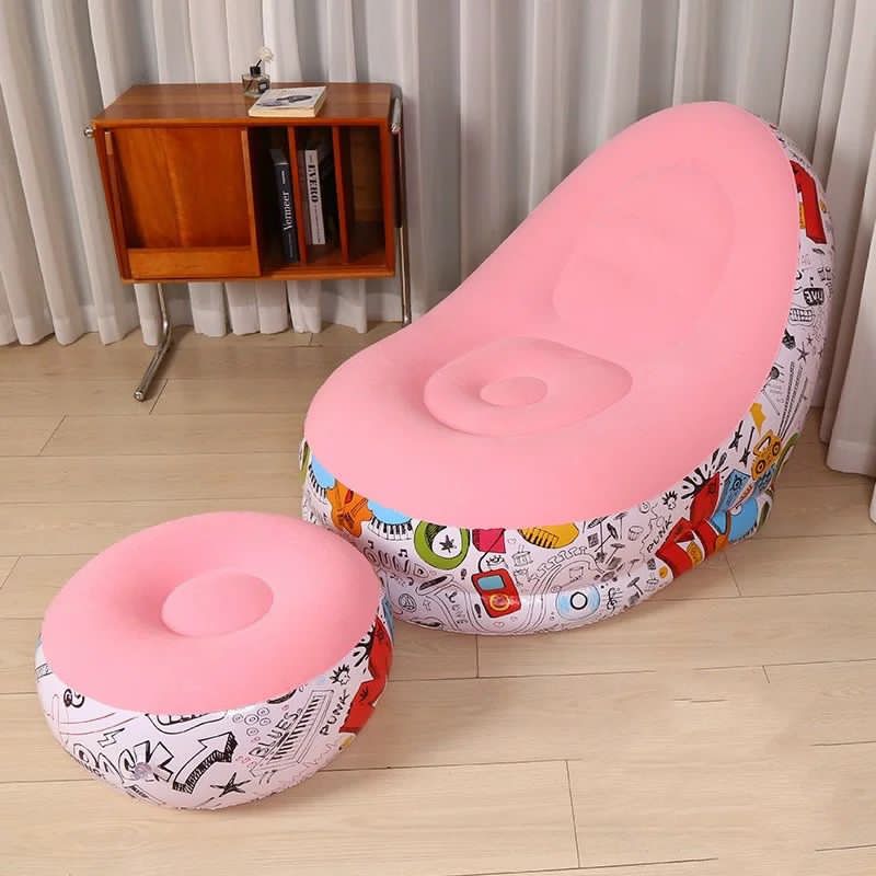 Two pink stools with colorful patterns on a wooden floor.