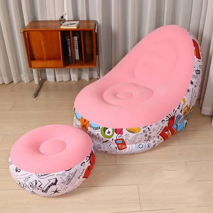 Two pink stools with colorful patterns on a wooden floor.